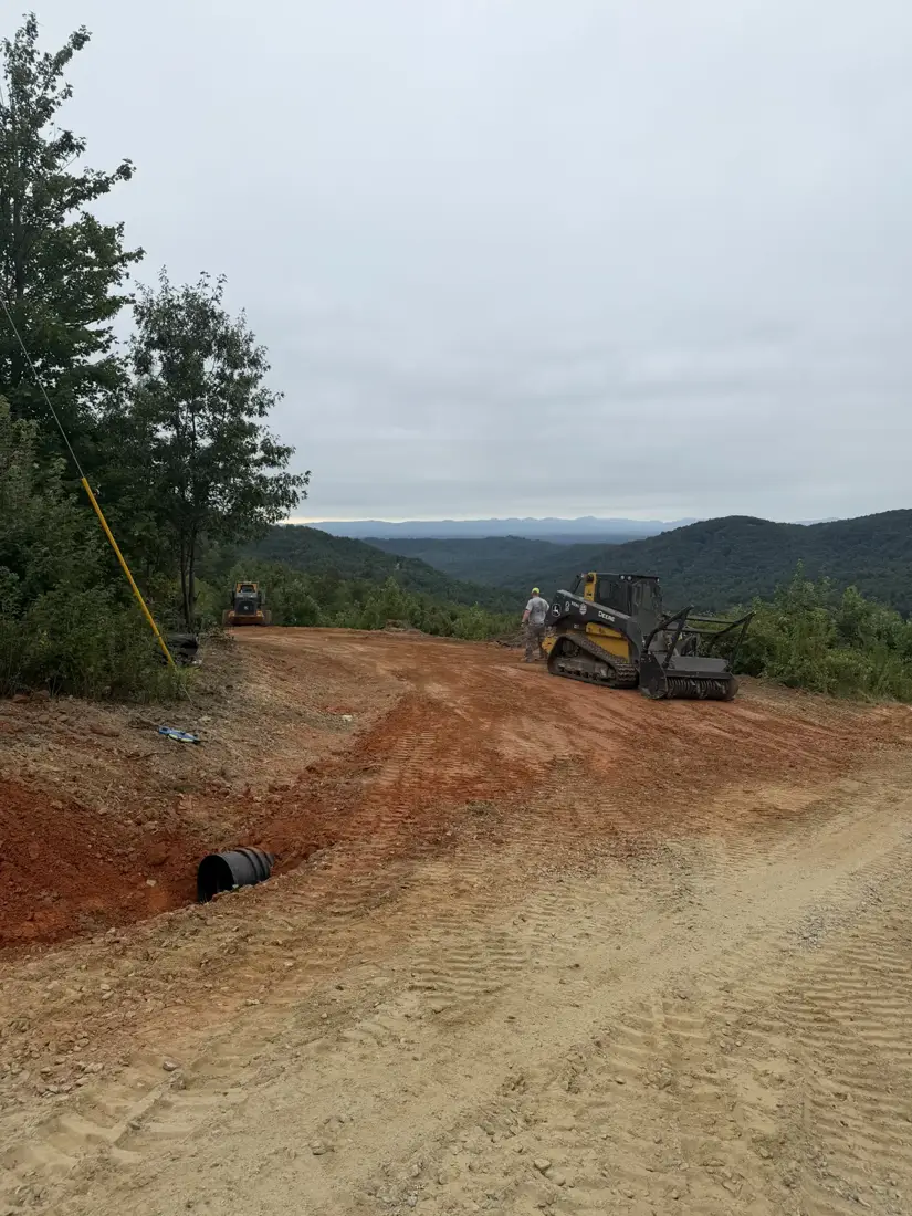 New culvert pipe set at a driveway entrance