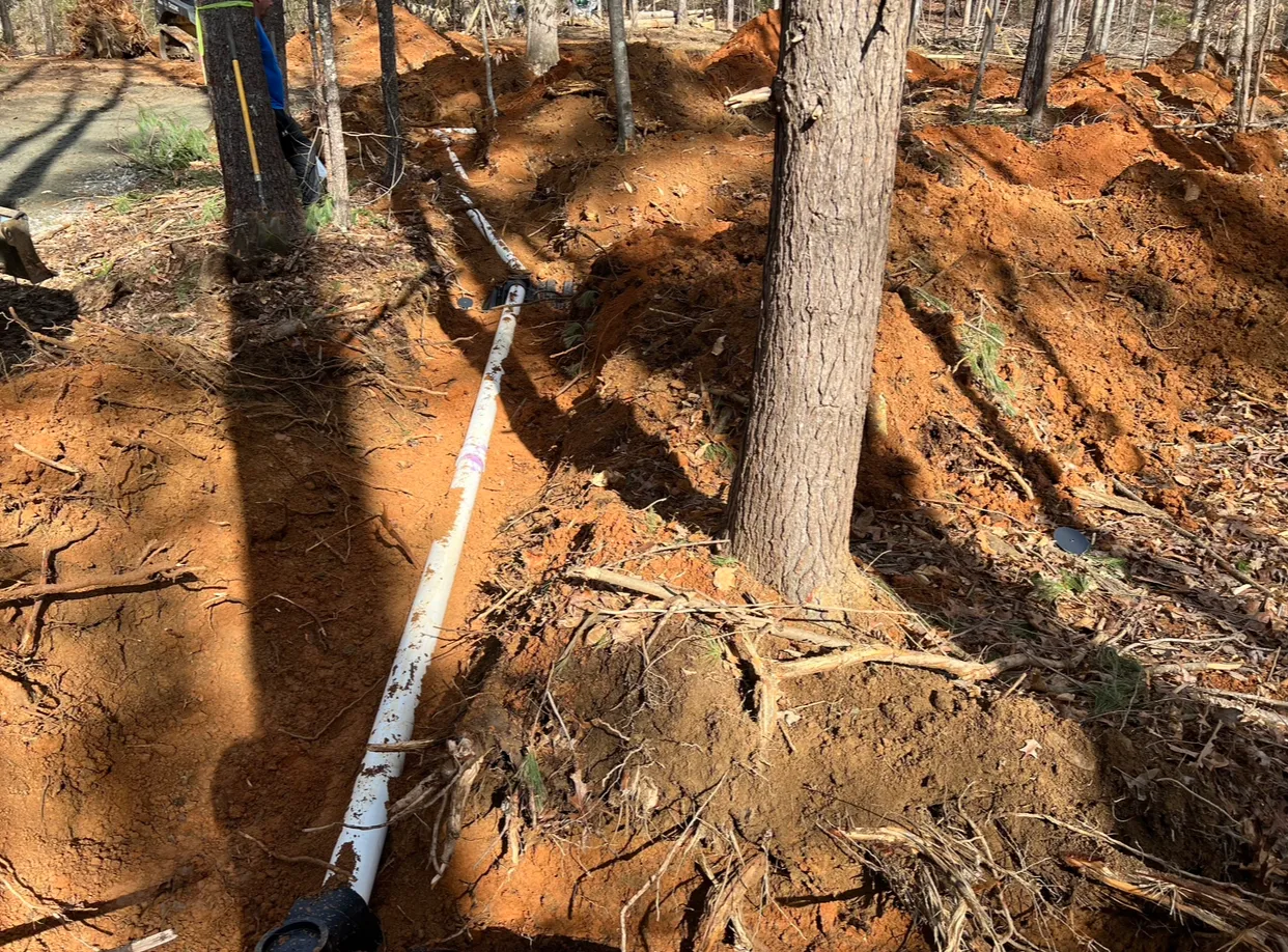 Septic pipe installation with precision measuring